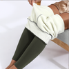 Cozy leggings with a fleece lining that are army green are worn by a woman with a gold metallic skirt on who is sitting down - Fleece Chic