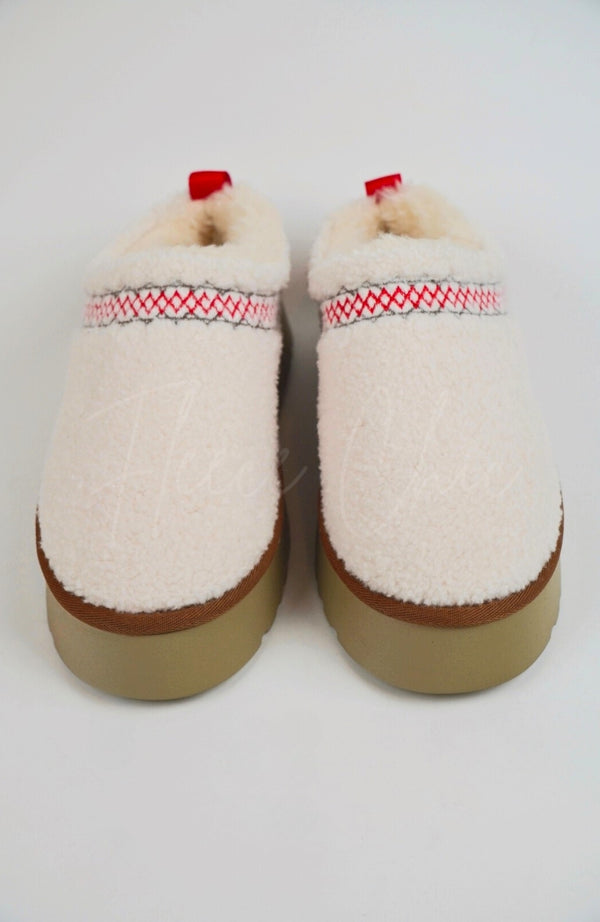 Teddy platform slippers by Fleece Chic on a white background.