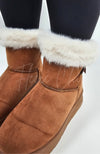 A close-up detail shot of the fur trim on a pair of winter boots by Fleece Chic.