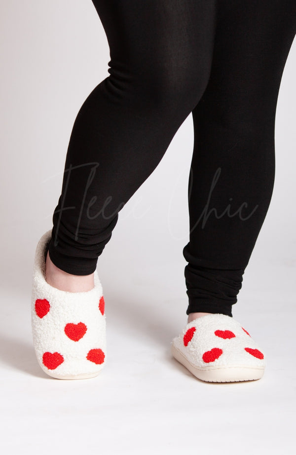 Women's slippers that are great for Valentine's day are white with little red hearts - Fleece Chic
