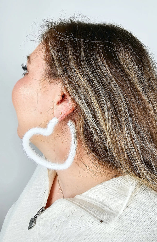 Heart shaped earrings that are white and fluffy by Fleece Chic.