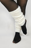 A woman wears white ankle warmers by Fleece Chic.