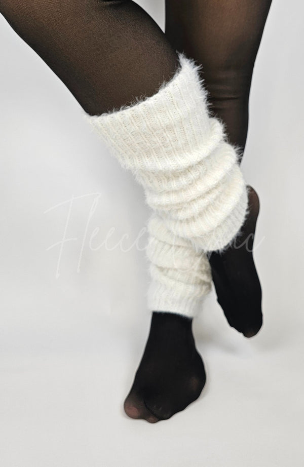 A woman wears white ankle warmers by Fleece Chic.