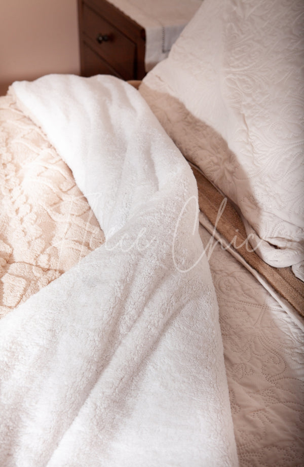 Sherpa comforter is turned back to show its fluffy underside - Fleece Chic