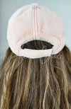 The back of Fleece Chic’s pink Fur Baseball Cap, showcasing its fluffy texture.