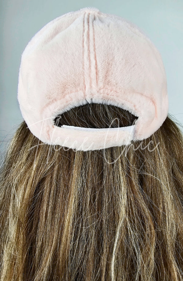 The back of Fleece Chic’s pink Fur Baseball Cap, showcasing its fluffy texture.