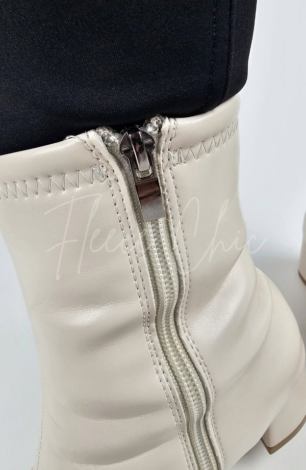 A close-up of the zipper closure for a pair of Leather Winter Boots - Fleece Chic