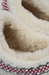A close up of a pair of teddy platform slippers by Fleece Chic.