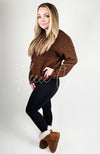 A woman in brown winter boots, a brown sweater,and black leggings - Fleece Chi