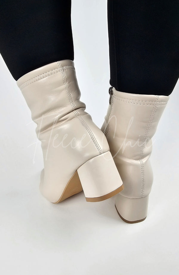 The backside of Leather Winter Boots by Fleece Chic are displayed for the camera.