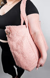 A pink shearling zippered tote bag by Fleece Chic.