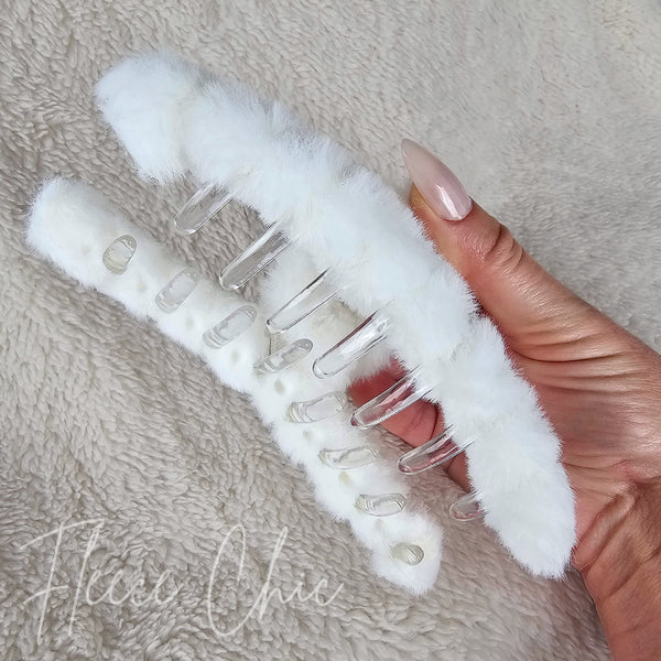 The underside detail of a white fluffy claw hair clip by Fleece Chic.