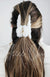 A claw hair clip that is fluffy and white is used in a half updo on a woman's brown long hair - Fleece Chic