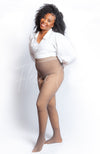 Opaque tights with a fleece lining are worn by an African American woman in a white blouse - Fleece Chic
