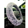 A close up detail shot of a Fuzzy Steering Wheel Cover that is black with gray tips to look like real fur - Fleece Chic