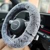 A close-up detail shot of a Fuzzy Steering Wheel Cover that is black that gradates into light gray - Fleece Chic