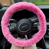 A close up detail shot of a pink steering wheel cover that looks like real fur - Fleece Chic