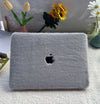 A laptop case cover for MacBooks by Fleece Chic that has a plush exterior and is medium gray.