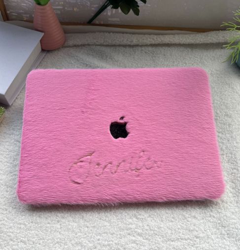 A hot pink laptop case cover for MacBooks by Fleece Chic that has a plush exterior.
