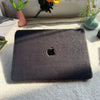A black laptop case cover for MacBooks by Fleece Chic that has a plush exterior.