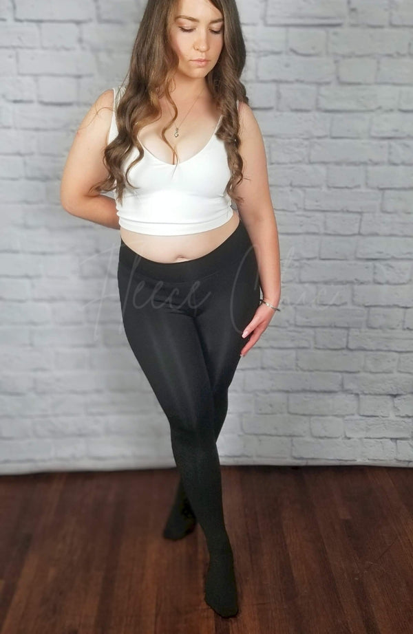 Fleece lined tights in black with fuzzy lining are paired with a white v-neck crop top - Fleece Chic