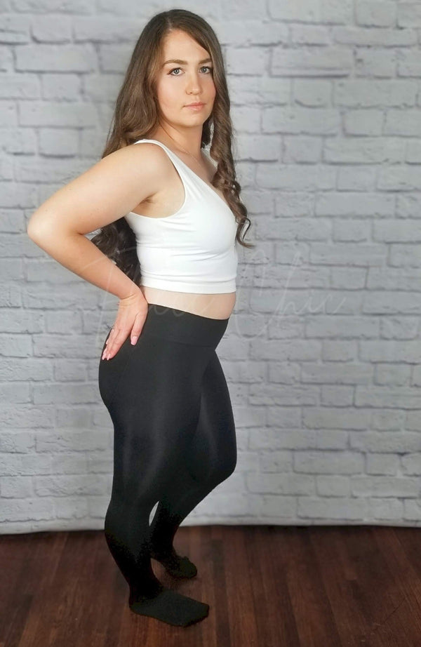 Fleece Lined Tights that have a plush lining are worn by a woman with long brown hair and are paired with a white crop top - Fleece Chic