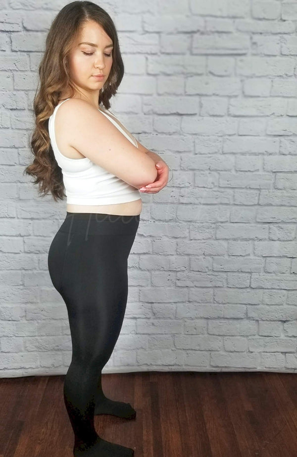 Fleece lined tights that have a plush lining are worn by a woman with long brown hair and are paired with a white crop top - Fleece Chic