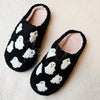 Fuzzy slippers with cute ghost motifs by Fleece Chic.