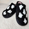 Fuzzy slippers with cute ghost motifs by Fleece Chic.