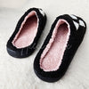 Cute fuzzy slippers with ghosts on them by Fleece Chic.