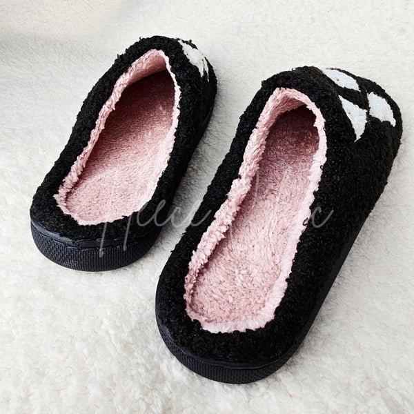 Cute fuzzy slippers with ghosts on them by Fleece Chic.