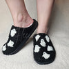 Spooky season ghost slippers that are fuzzy by Fleece Chic.
