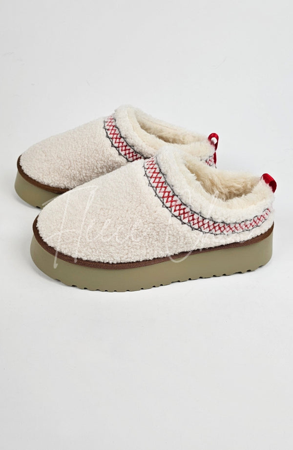 Platform slippers that are white with a teddy fleece are displayed on a plain background - Fleece Chic