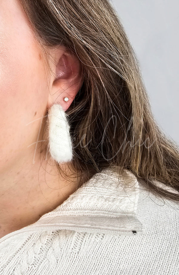Medium hoop earrings that are white and fluffy by Fleece Chic.