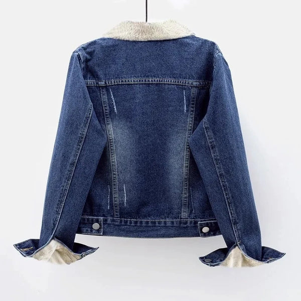 The backside of a dark blue jean sherpa jacket with teddy interior in the trucker style by Fleece Chic.