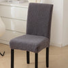 A medium gray sherpa chair cover on a chair - Fleece Chic