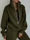 A green sweatsuit with matching sweatshirt and sweatpants are worn by a woman - Fleece Chic