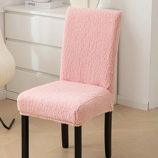 A sherpa chair cover that is light pink and offers a cozy appearance while adding protection - Fleece Chic