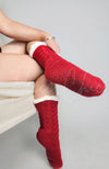 You'll have cozy feet in these red grip socks that have a white sherpa lining - Fleece Chic