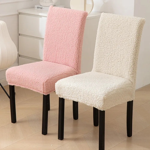 Sherpa chair covers that are light pink and white are on chairs, providing a plush and cozy appearance while adding protection - Fleece Chic