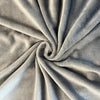 A plush blanket that is gray has a close-up to show its detail - Fleece Chic