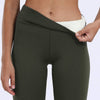 Cozy leggings that are army green are worn by a woman who is pulling down their waist to show off their plush interior - Fleece Chic
