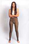 A woman models pantyhose leggings that are black for a chic clothing store - Fleece Chic