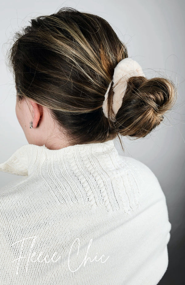A woman wears her hair in a bun with a Fluffy Scrunchie holding it in place - Fleece Chic