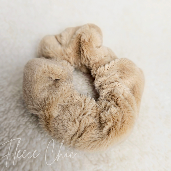 A brown fluffy scrunchie has a close-up detail shot -Fleece Chic