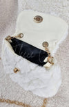 A close-up of an open fur purse to show the inside detail - Fleece Chic