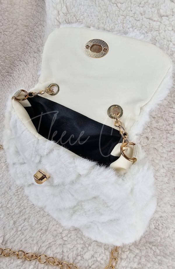 A close-up of an open fur purse to show the inside detail - Fleece Chic
