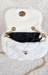A close-up of an open fur purse to show the inside detail - Fleece Chic