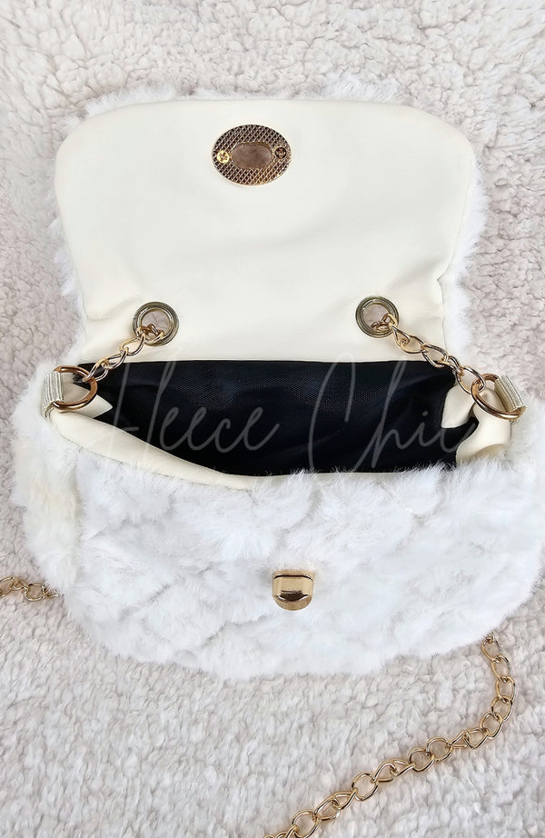 A close-up of an open fur purse to show the inside detail - Fleece Chic