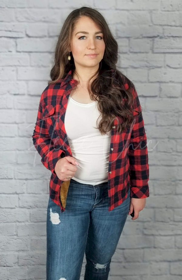 A woman wears a red and navy Lined Flannel Shirt Jacket with jeans and a white shirt - Fleece Chic